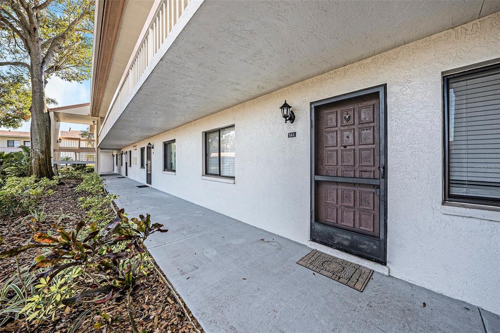 141 Lakeview Way, Unit 141 Oldsmar, FL 34677 - Photo 27 of 28 front view of a house with a yard