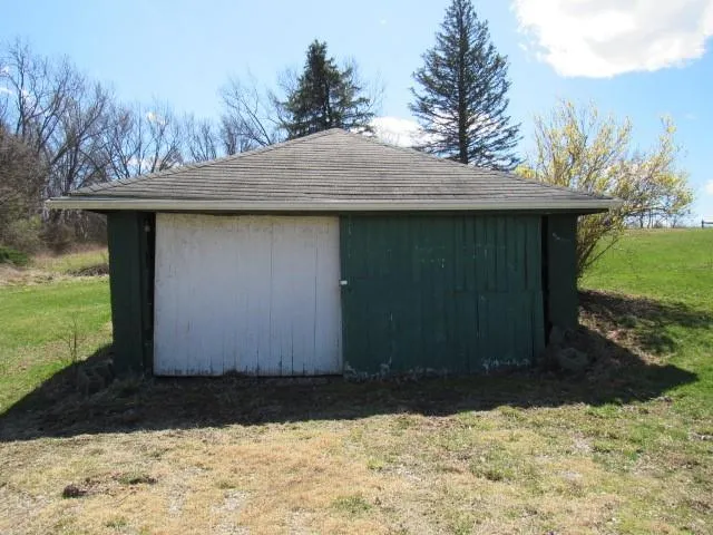 a front view of house with yard and trees