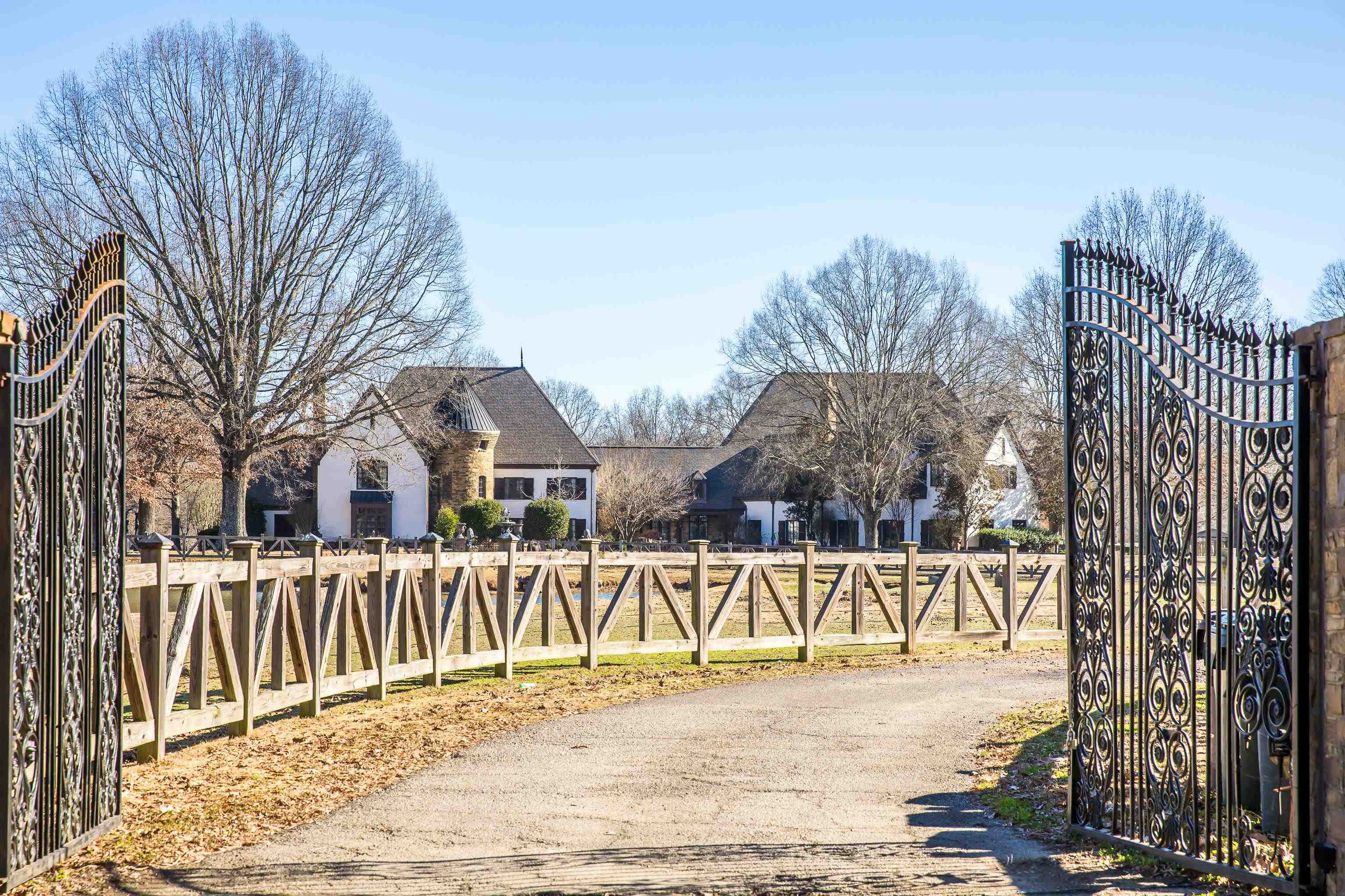 5110 Reynolds Road Collierville, TN 38017 - Photo 39 of 40 View of asphalt driveway featuring a gated entry and a gate
