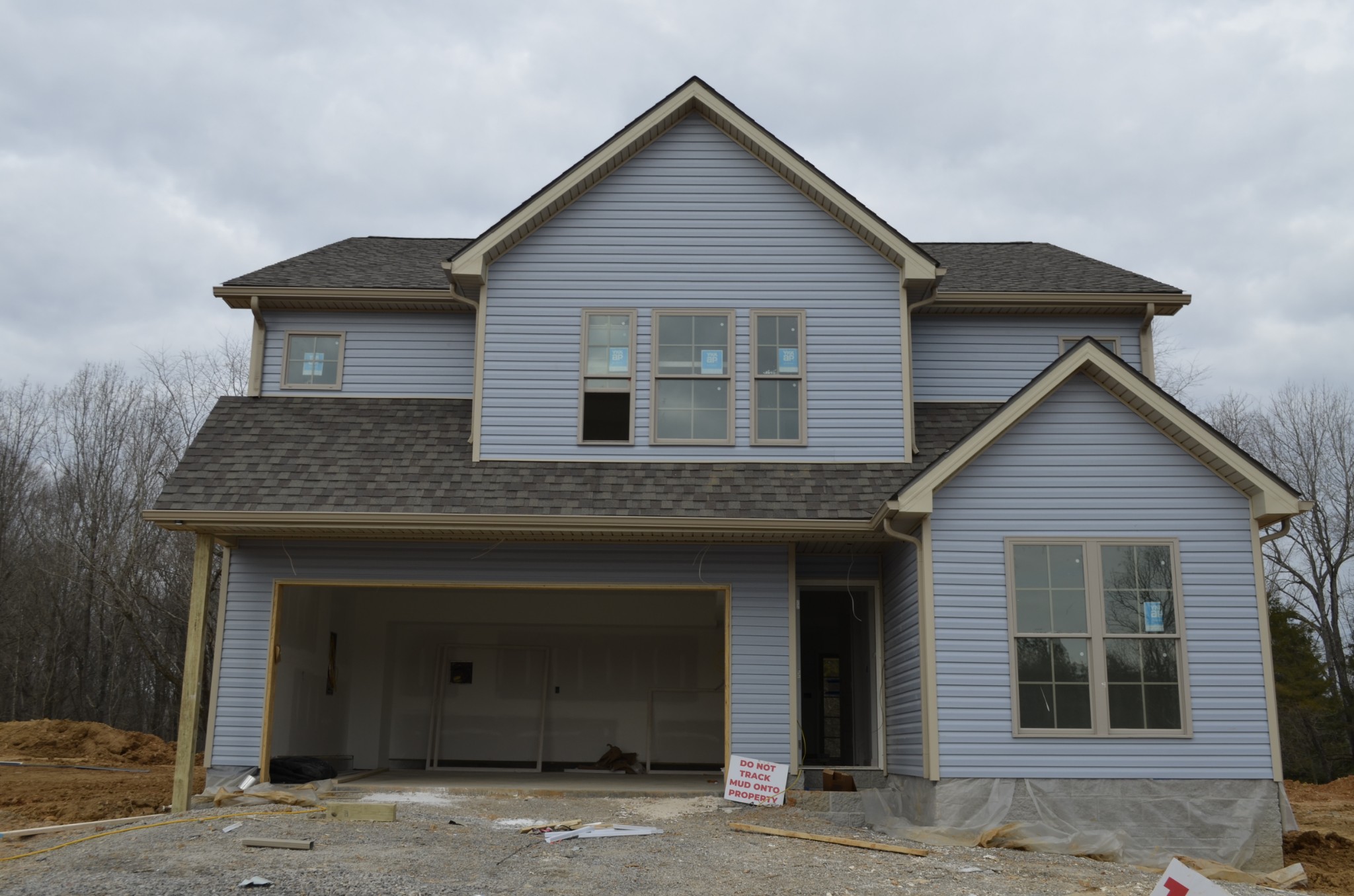 a front view of a house with a garage