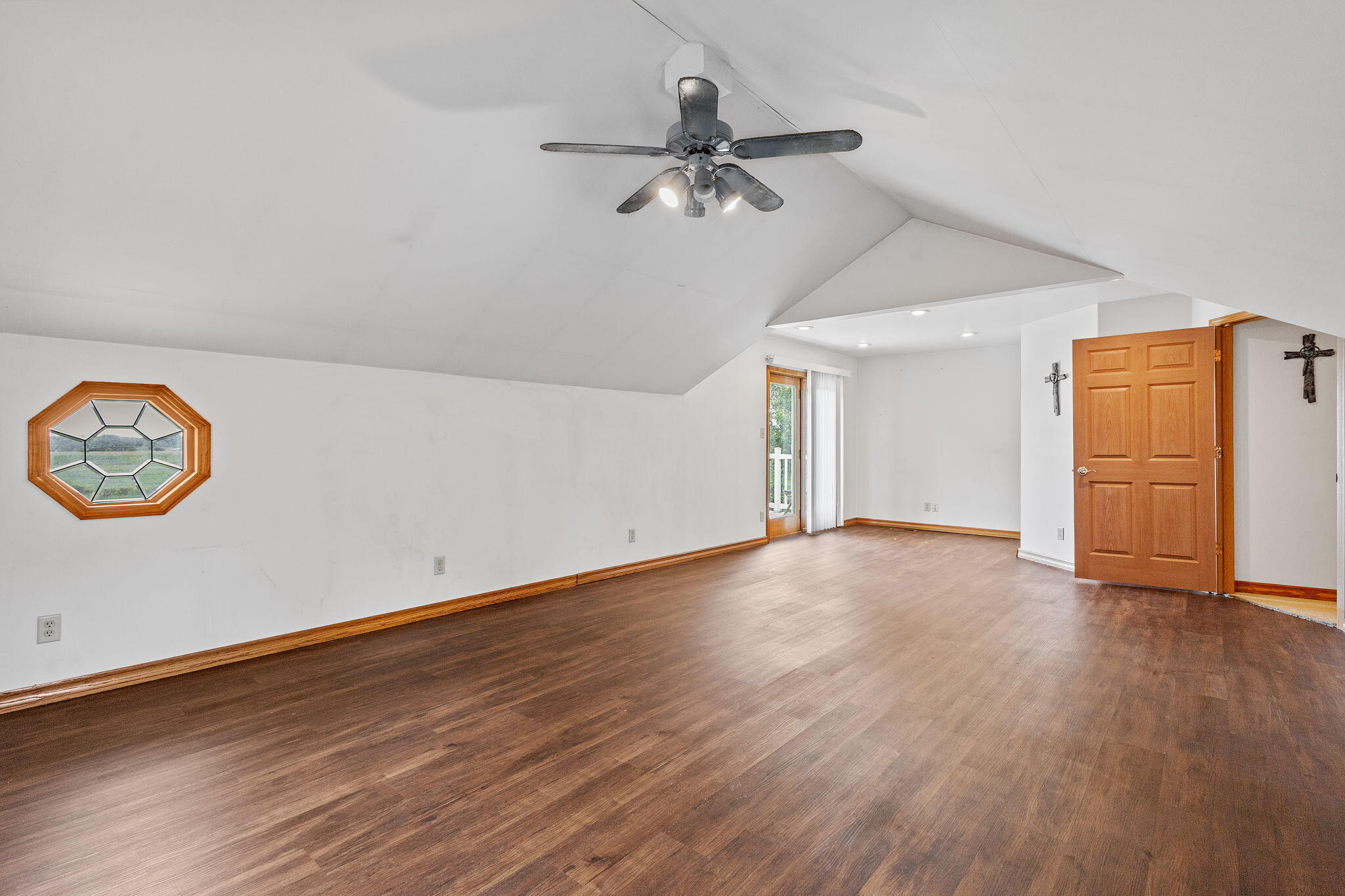 2549 East 1100 North Demotte, IN 46310 - Photo 23 of 74 a view of a room with wooden floor and a ceiling fan