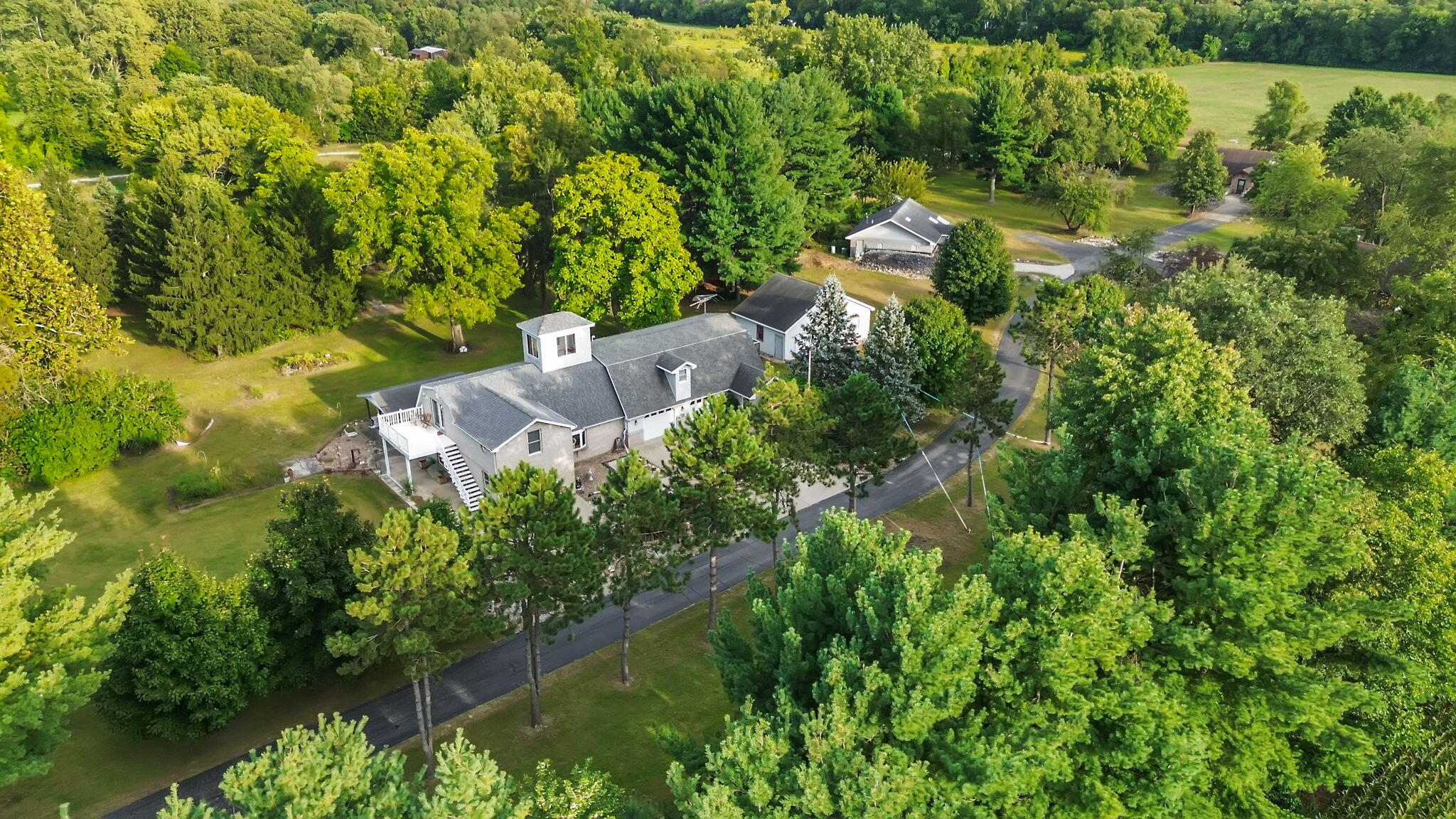 2549 East 1100 North Demotte, IN 46310 - Photo 73 of 74 an aerial view of residential house with outdoor space and trees all around