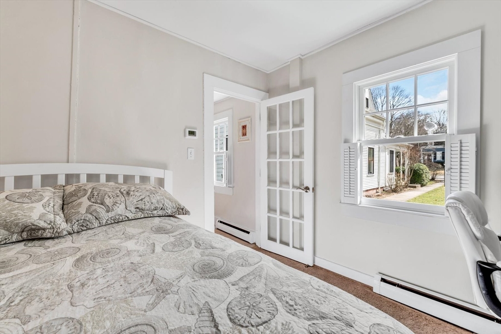 344 Main Street, Unit 5 Barnstable, MA 02632 - Photo 14 of 28 a large white bed in a white room