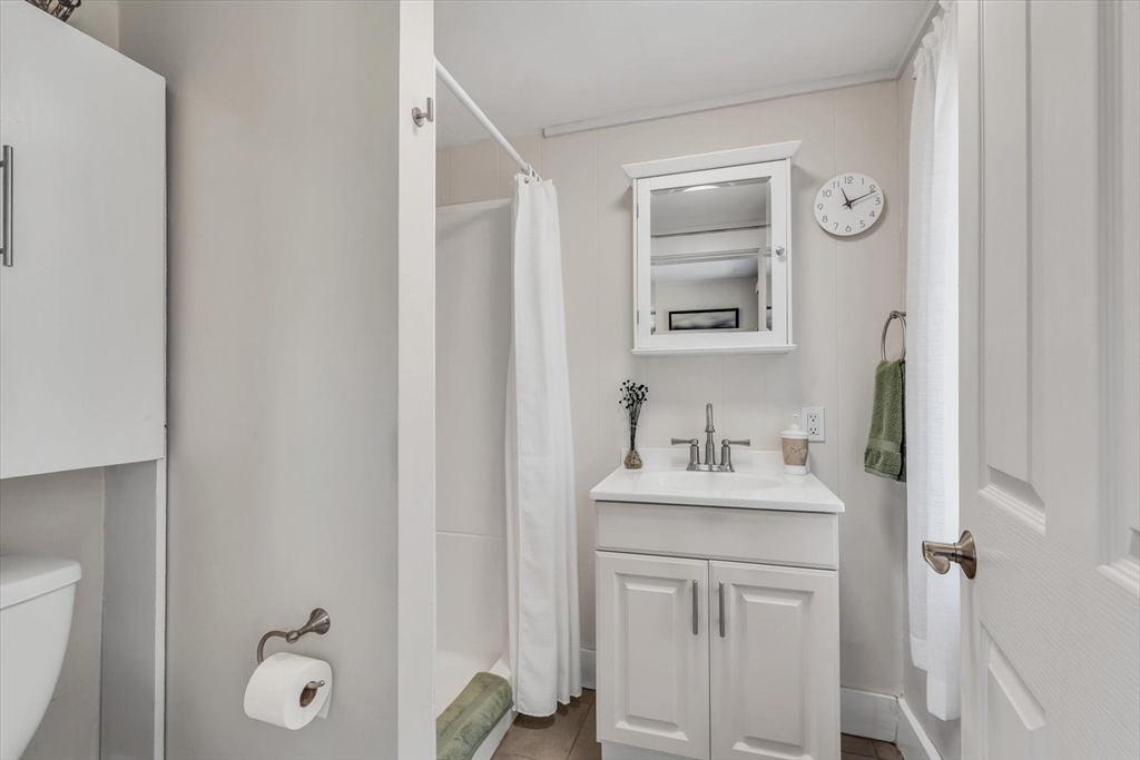 344 Main Street, Unit 5 Barnstable, MA 02632 - Photo 21 of 28 a bathroom with a sink vanity and a mirror