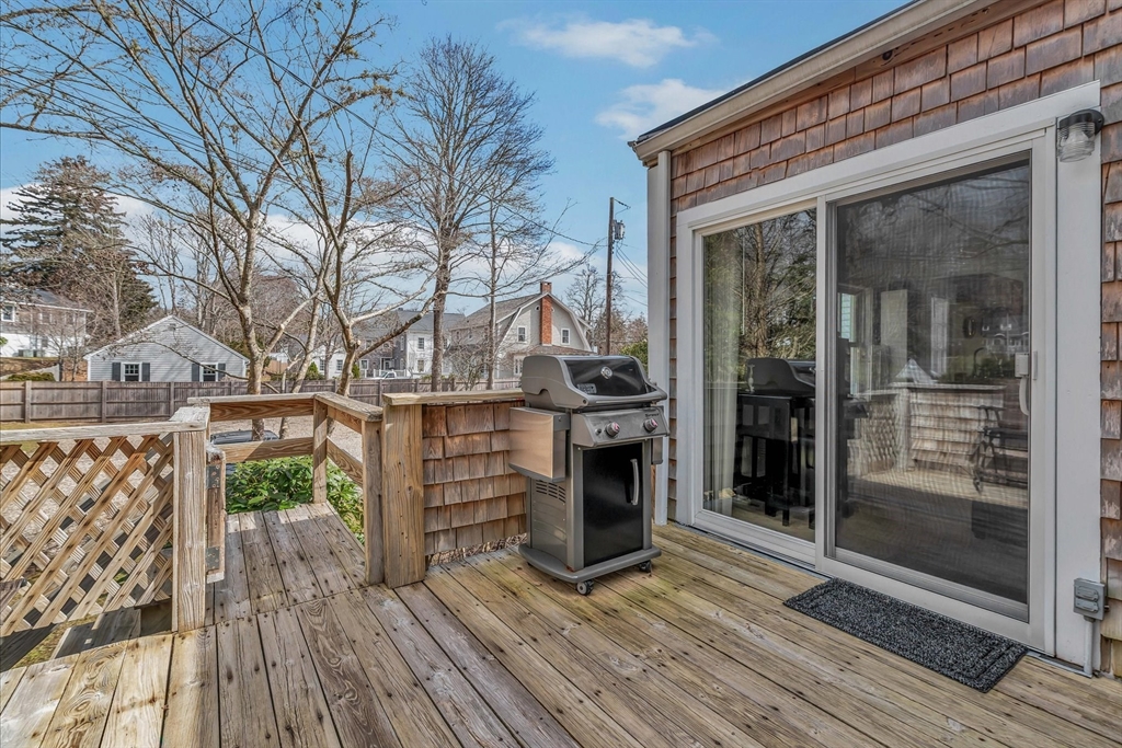 344 Main Street, Unit 5 Barnstable, MA 02632 - Photo 22 of 28 a view of a balcony with wooden floor and iron fence