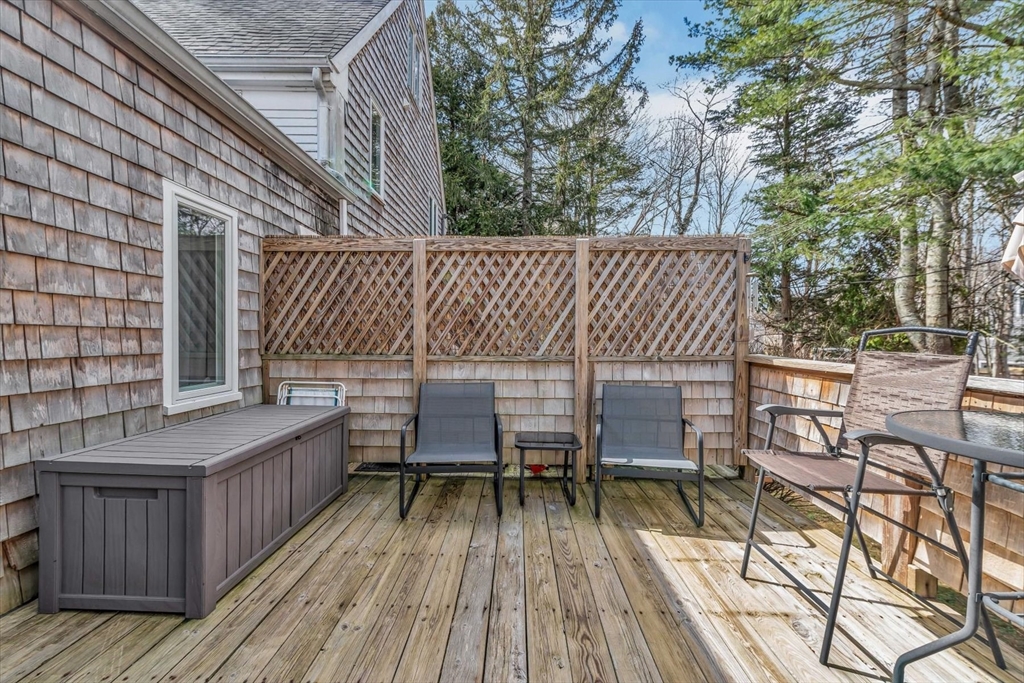 344 Main Street, Unit 5 Barnstable, MA 02632 - Photo 25 of 28 a outdoor view with a sitting space and large trees