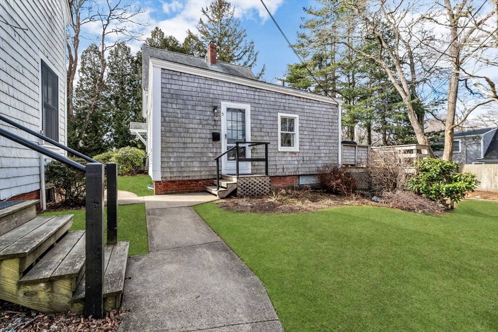 344 Main Street, Unit 5 Barnstable, MA 02632 - Photo 28 of 28 a view of backyard with a garden and outdoor seating