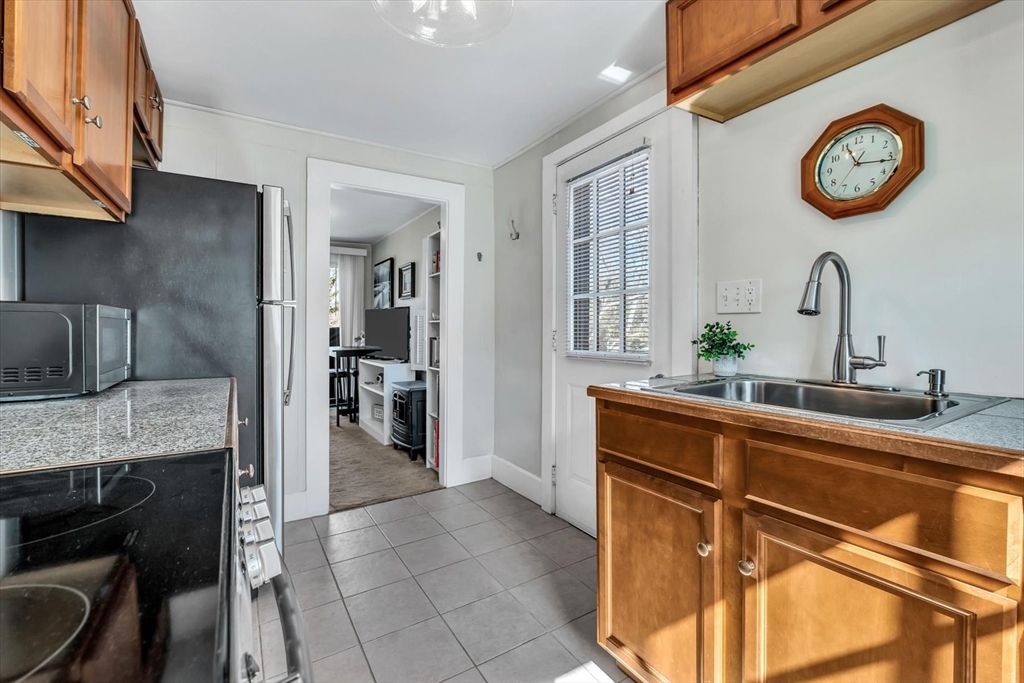344 Main Street, Unit 5 Barnstable, MA 02632 - Photo 7 of 28 a view of a kitchen with a oven and a refrigerator