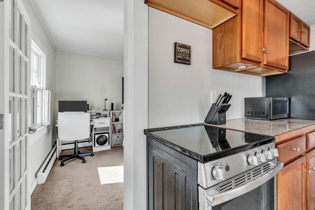 344 Main Street, Unit 5 Barnstable, MA 02632 - Photo 8 of 28 a stove top oven sitting inside of a kitchen