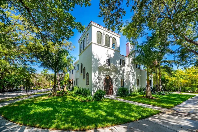 a front view of house with yard and green space