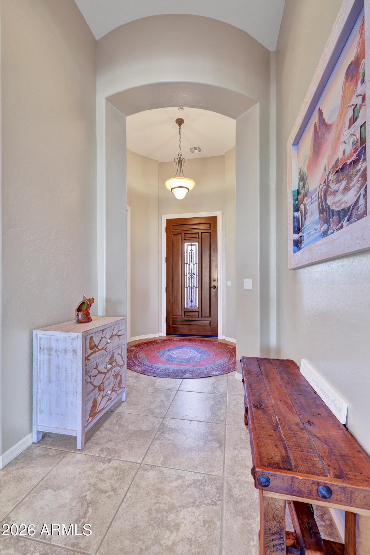 12510 West Bajada Road Peoria, AZ 85383 - Photo 15 of 84 a spacious bedroom with a bed and a chandelier