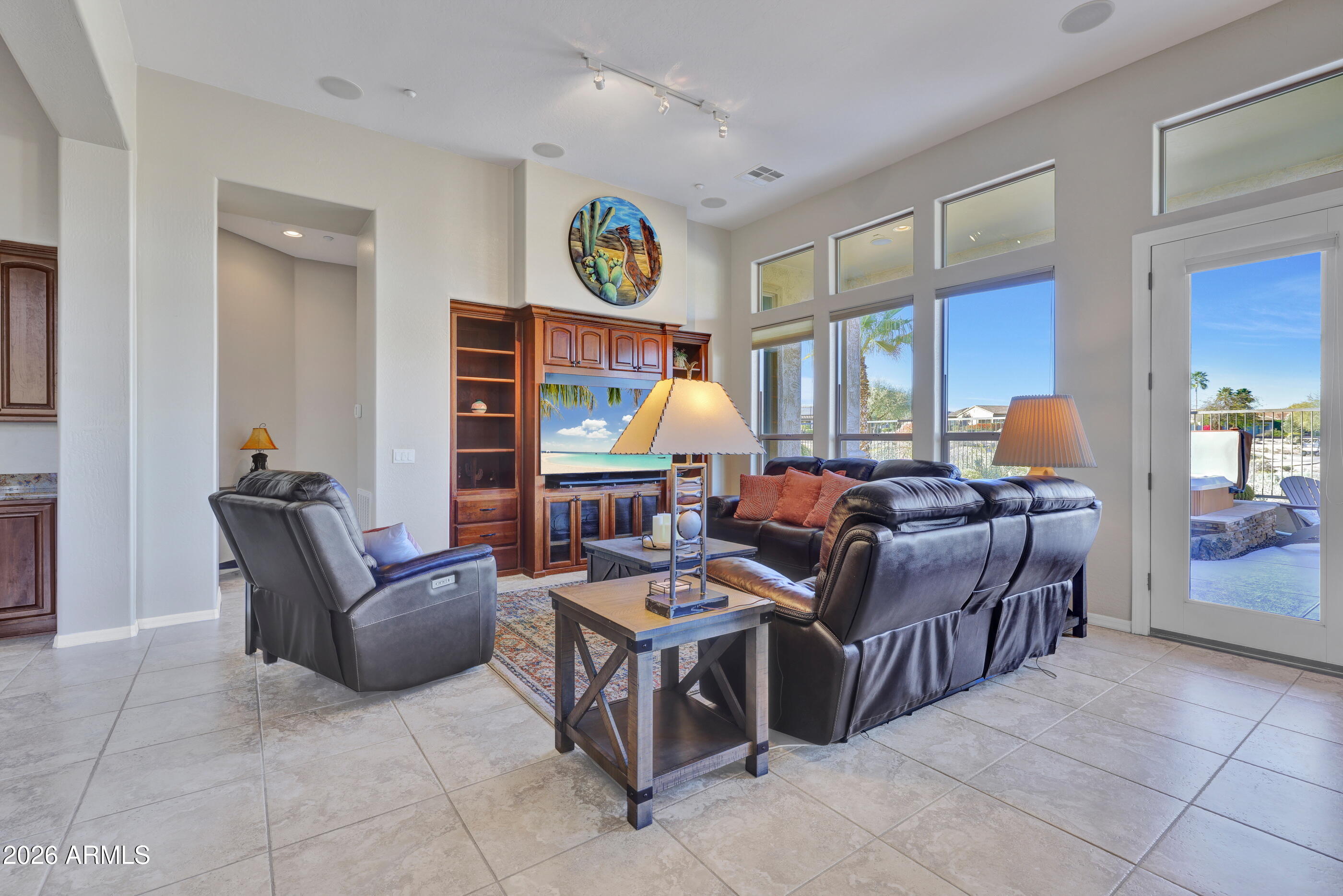 12510 West Bajada Road Peoria, AZ 85383 - Photo 17 of 84 a living room with fireplace furniture and a window