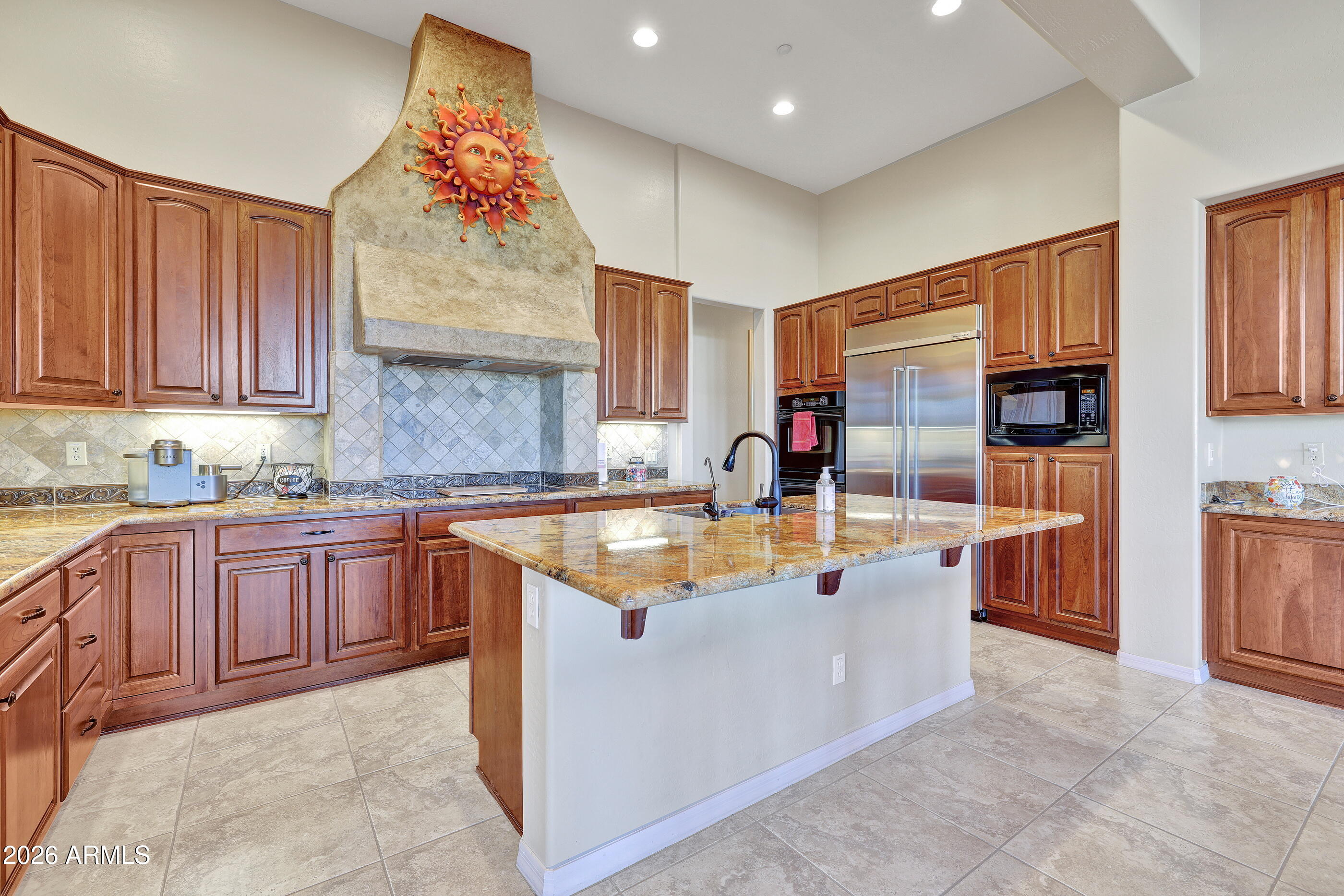 12510 West Bajada Road Peoria, AZ 85383 - Photo 19 of 84 a kitchen with stainless steel appliances granite countertop a sink counter space cabinets and a large window
