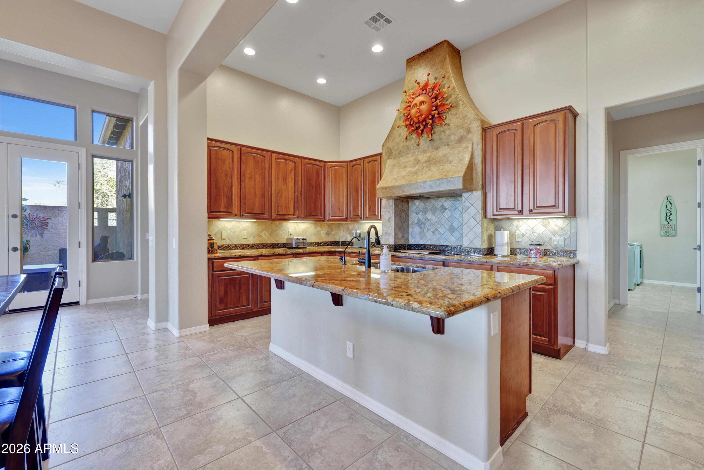 12510 West Bajada Road Peoria, AZ 85383 - Photo 20 of 84 a kitchen with stainless steel appliances granite countertop wooden cabinets a sink and a stove