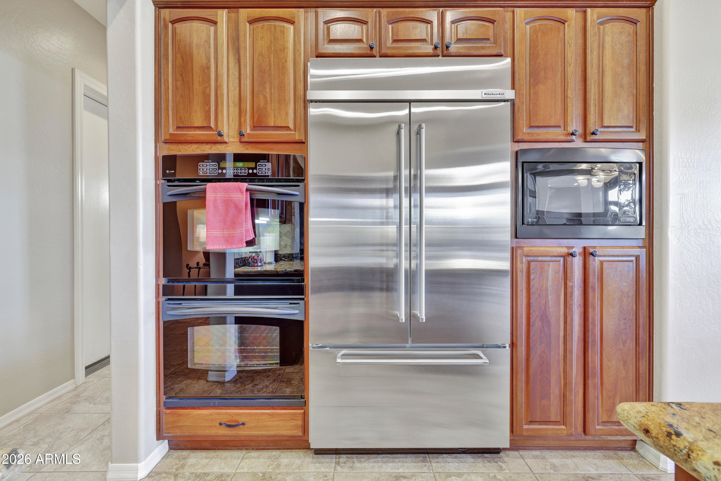 12510 West Bajada Road Peoria, AZ 85383 - Photo 23 of 84 a kitchen with a refrigerator and cabinets