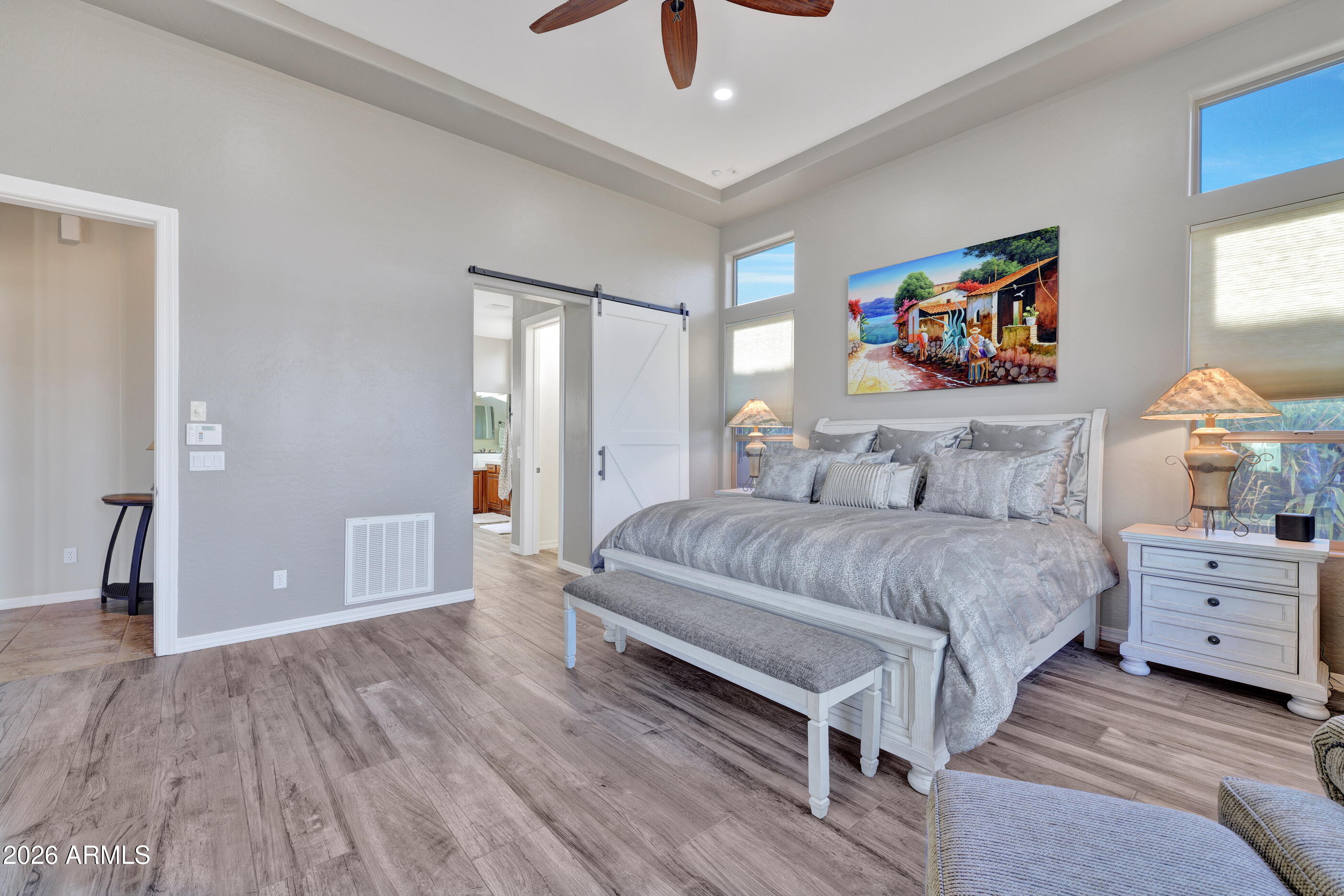 12510 West Bajada Road Peoria, AZ 85383 - Photo 31 of 84 a bedroom with a bed and a painting on the wall