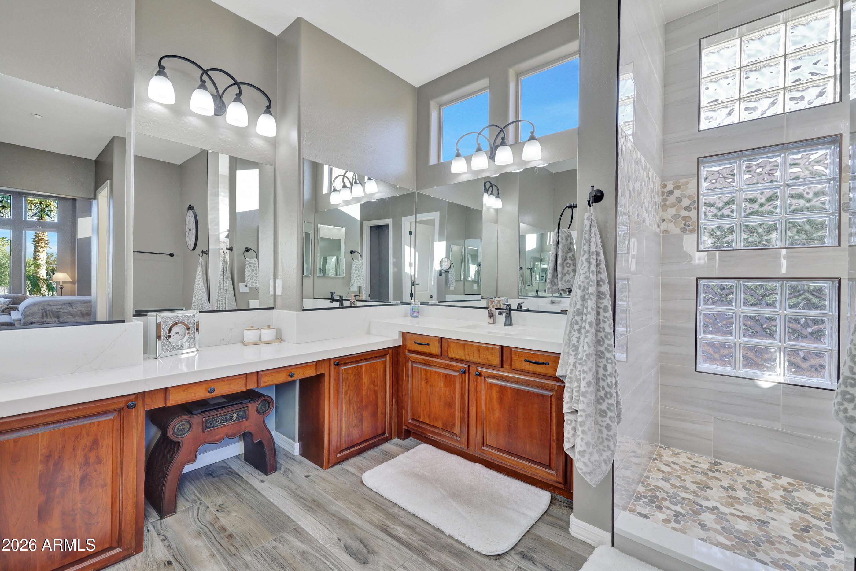 12510 West Bajada Road Peoria, AZ 85383 - Photo 32 of 84 a large bathroom with a sink a large mirror and a shower