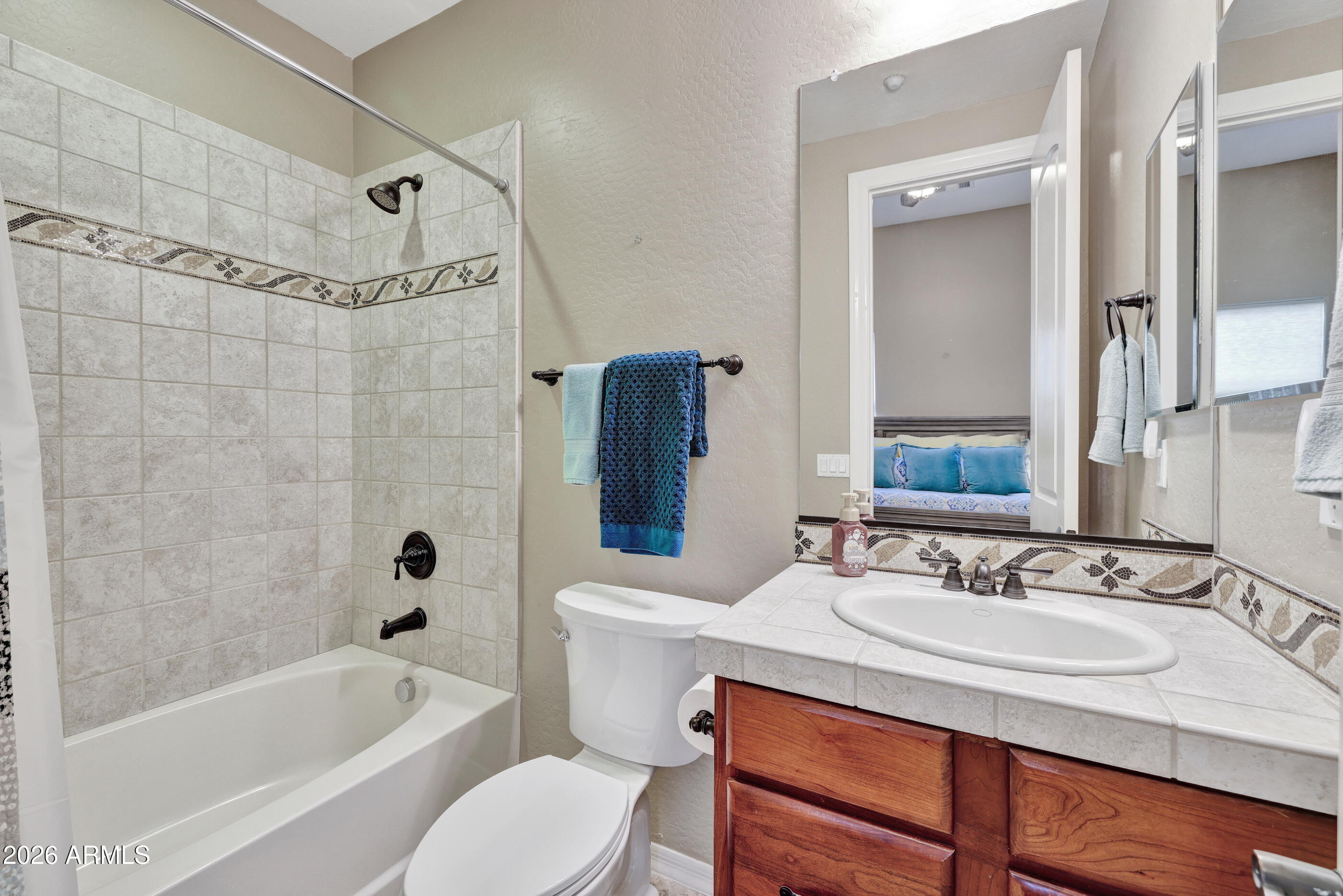 12510 West Bajada Road Peoria, AZ 85383 - Photo 36 of 84 a bathroom with a sink toilet a bathtub and shower