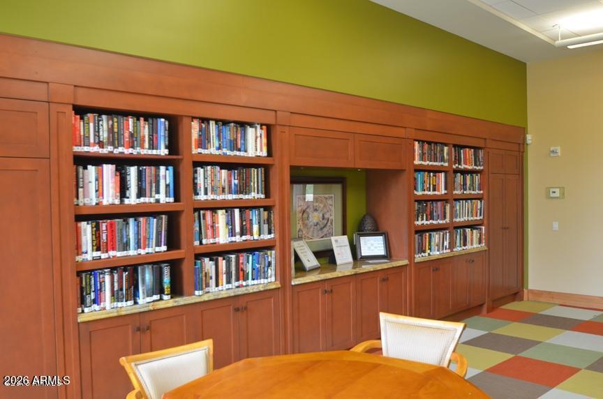 12510 West Bajada Road Peoria, AZ 85383 - Photo 61 of 84 a blue room with bookshelf and a book shelf