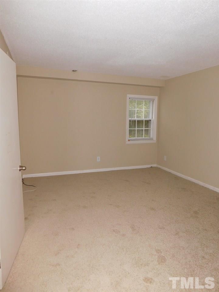 203 Jones Franklin Road Raleigh, NC 27606 - Photo 22 of 26 a view of an empty room with a window