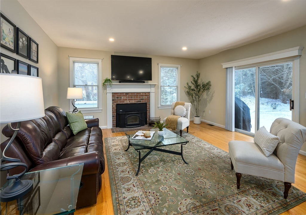 43 Edgewood Road Southborough, MA 01772 - Photo 14 of 36 a living room with furniture or couch and a fireplace