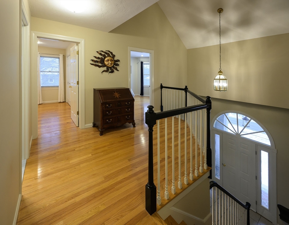 43 Edgewood Road Southborough, MA 01772 - Photo 17 of 36 a view of a hallway with wooden floor and staircase