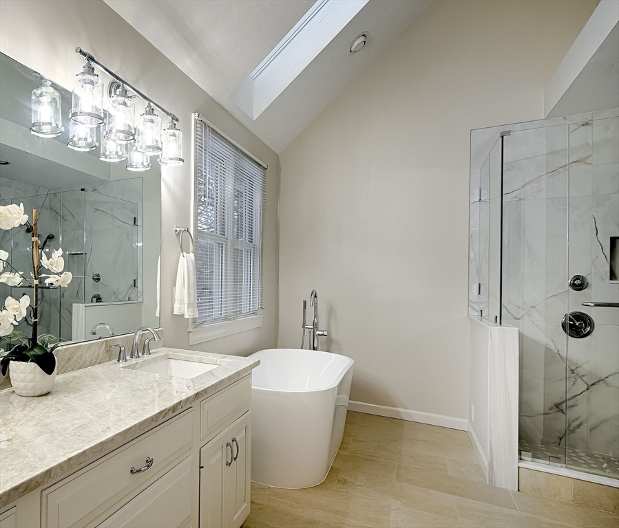 43 Edgewood Road Southborough, MA 01772 - Photo 20 of 36 a bathroom with a granite countertop sink a toilet a mirror and shower