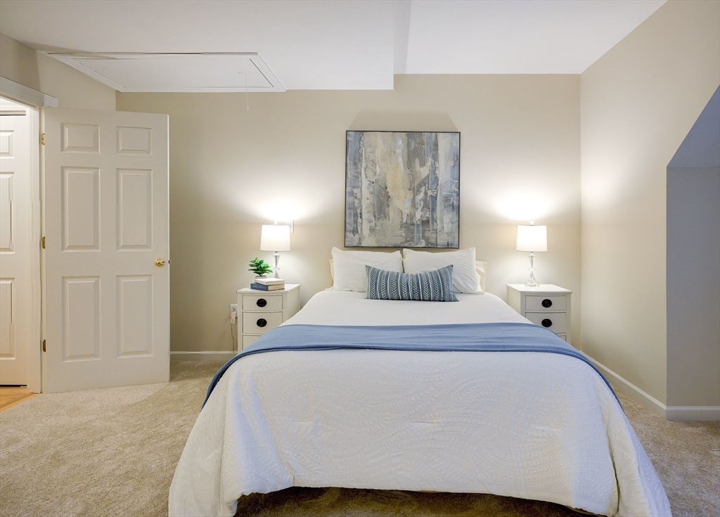 43 Edgewood Road Southborough, MA 01772 - Photo 24 of 36 a bedroom with a bed and a painting on the wall