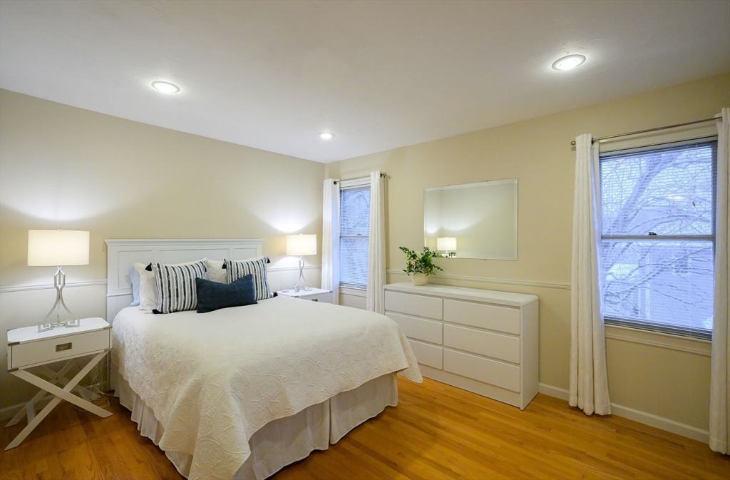 43 Edgewood Road Southborough, MA 01772 - Photo 27 of 36 a bedroom with a bed and a chandelier