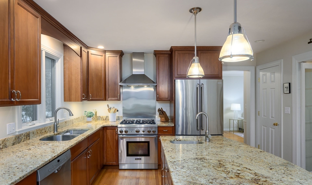 43 Edgewood Road Southborough, MA 01772 - Photo 6 of 36 a kitchen with kitchen island granite countertop a sink stainless steel appliances and cabinets