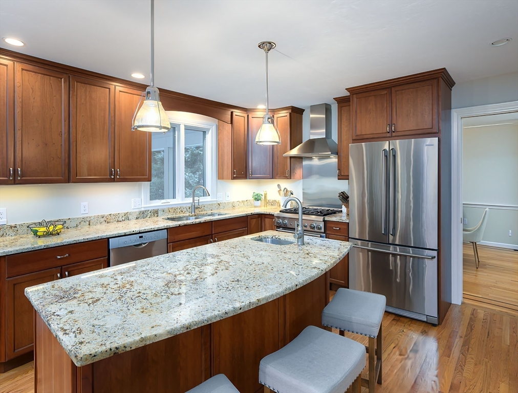 43 Edgewood Road Southborough, MA 01772 - Photo 8 of 36 a kitchen with stainless steel appliances granite countertop a sink refrigerator and microwave