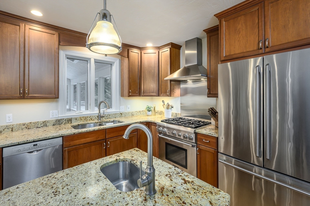 43 Edgewood Road Southborough, MA 01772 - Photo 9 of 36 a kitchen with stainless steel appliances granite countertop a sink stove and refrigerator