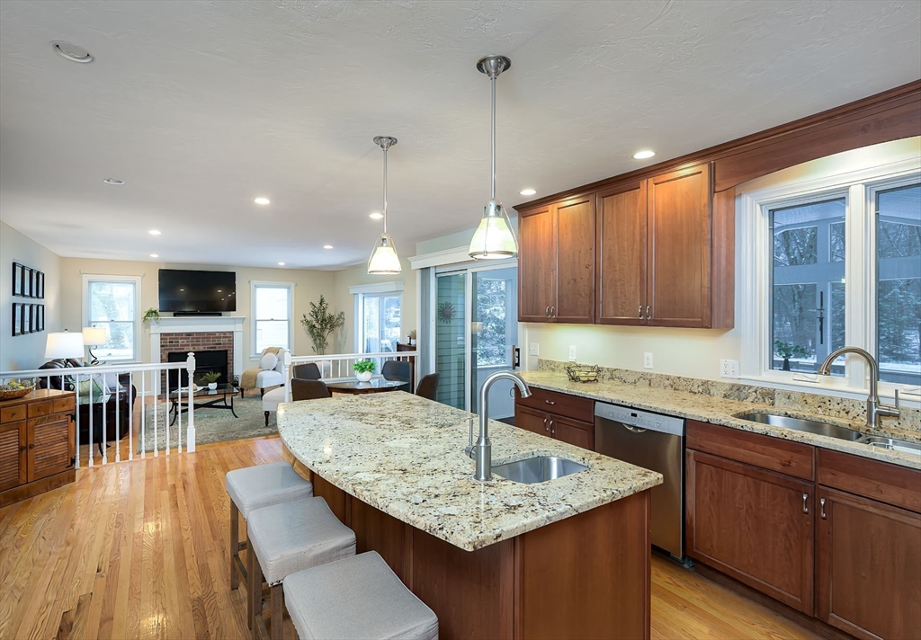 43 Edgewood Road Southborough, MA 01772 - Photo 10 of 36 a kitchen with center island table and chairs in it