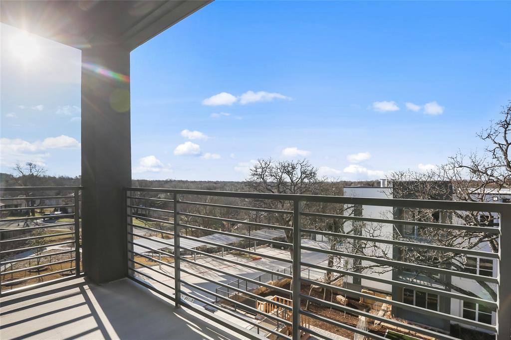 4801 Springdale Road Austin, TX 78723 - Photo 13 of 19 a view of a balcony with two chairs and a potted plant