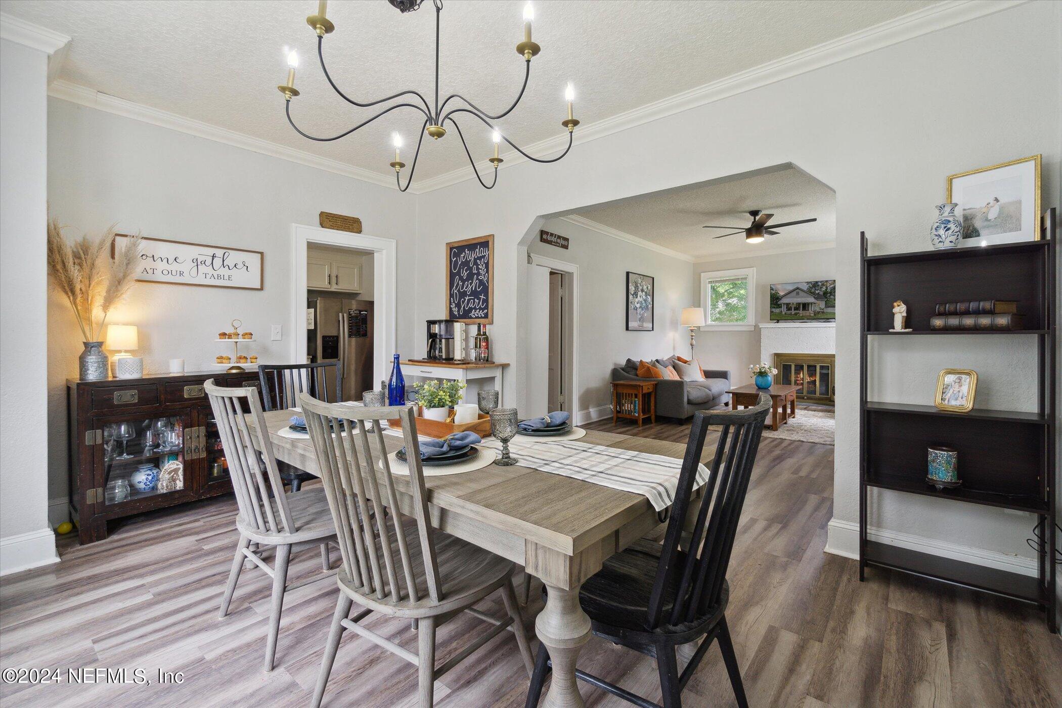1262 Murray Drive Jacksonville, FL 32205 - Photo 14 of 42 a view of a dining room with furniture and wooden floor