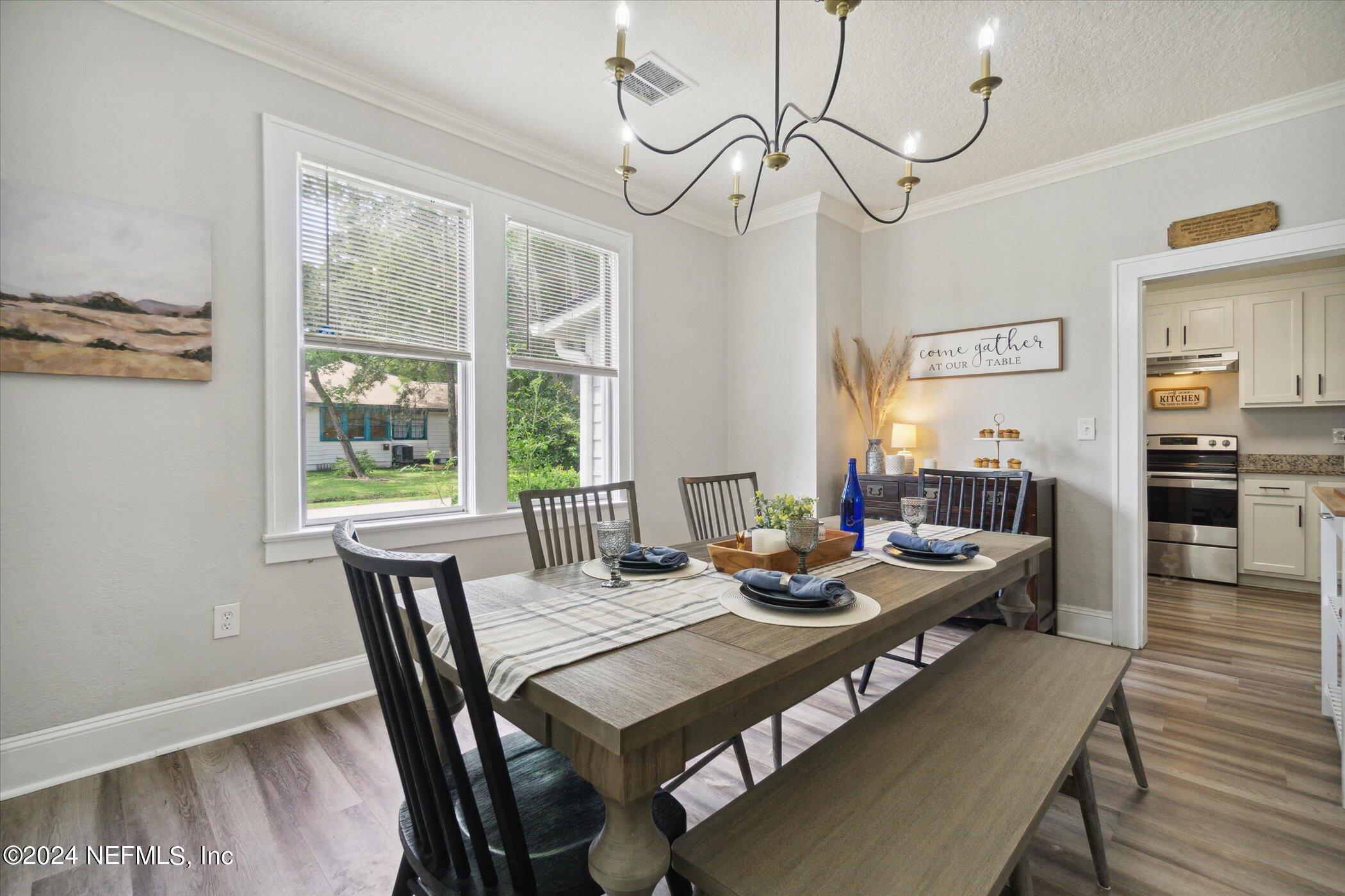 1262 Murray Drive Jacksonville, FL 32205 - Photo 15 of 42 a view of a dining room with furniture window and wooden floor