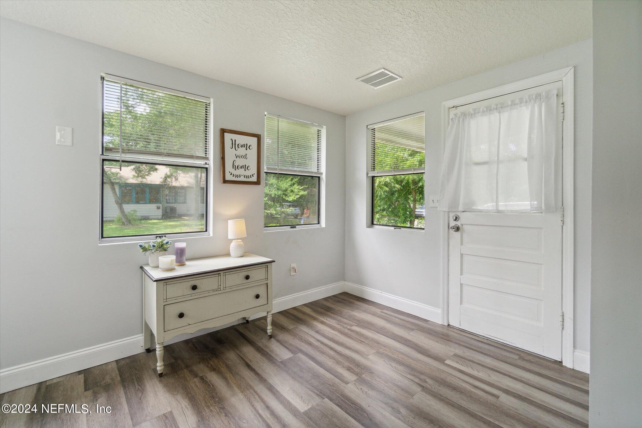 1262 Murray Drive Jacksonville, FL 32205 - Photo 33 of 42 a view of workspace with wooden floor and windows