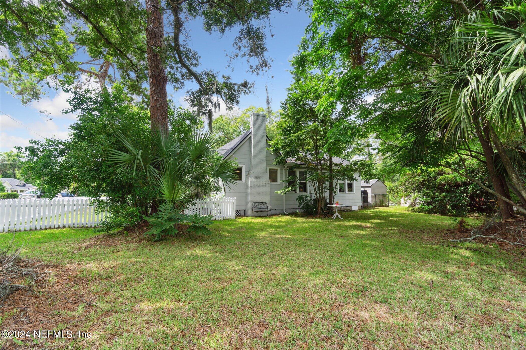 1262 Murray Drive Jacksonville, FL 32205 - Photo 34 of 42 a view of a house with a big yard and large trees