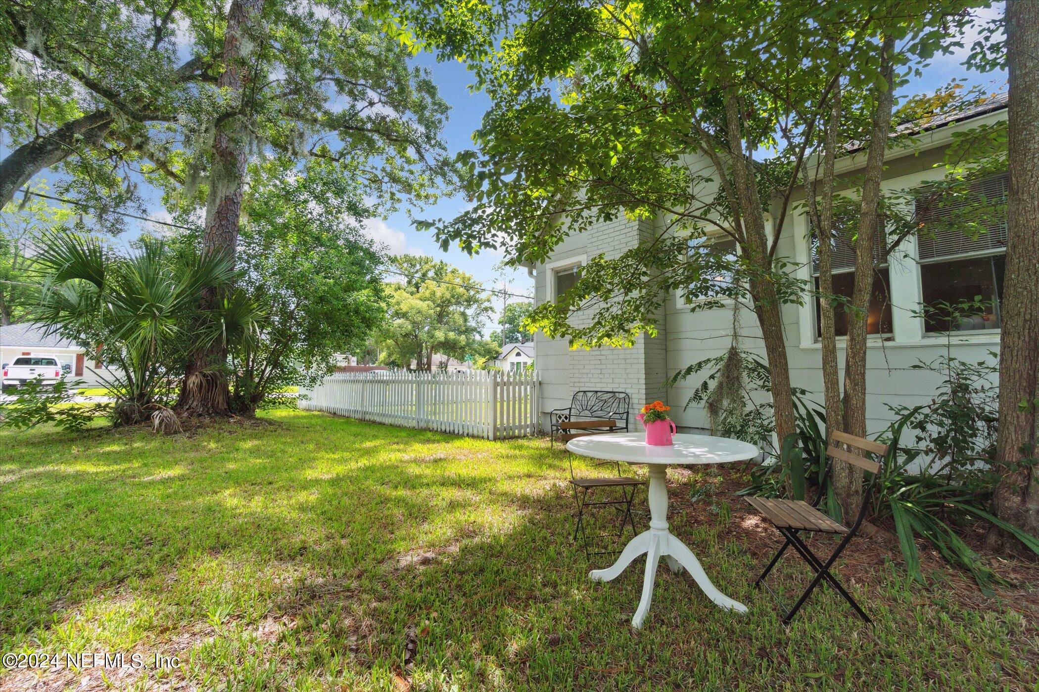 1262 Murray Drive Jacksonville, FL 32205 - Photo 36 of 42 a table and chairs in backyard of house