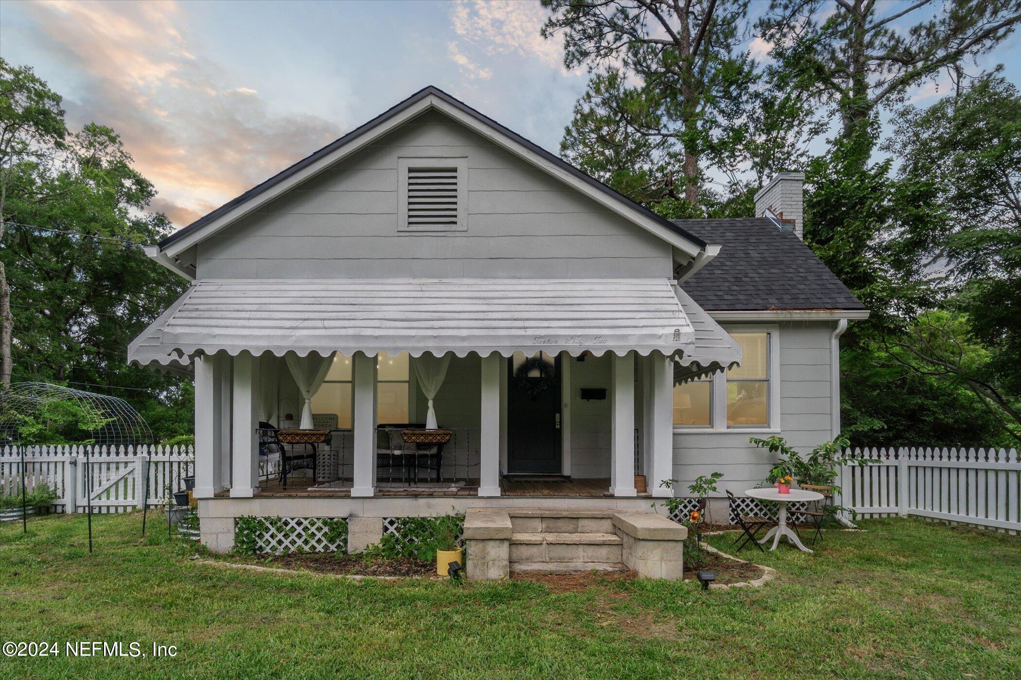 1262 Murray Drive Jacksonville, FL 32205 - Photo 6 of 42 a view of a house with a yard and sitting area