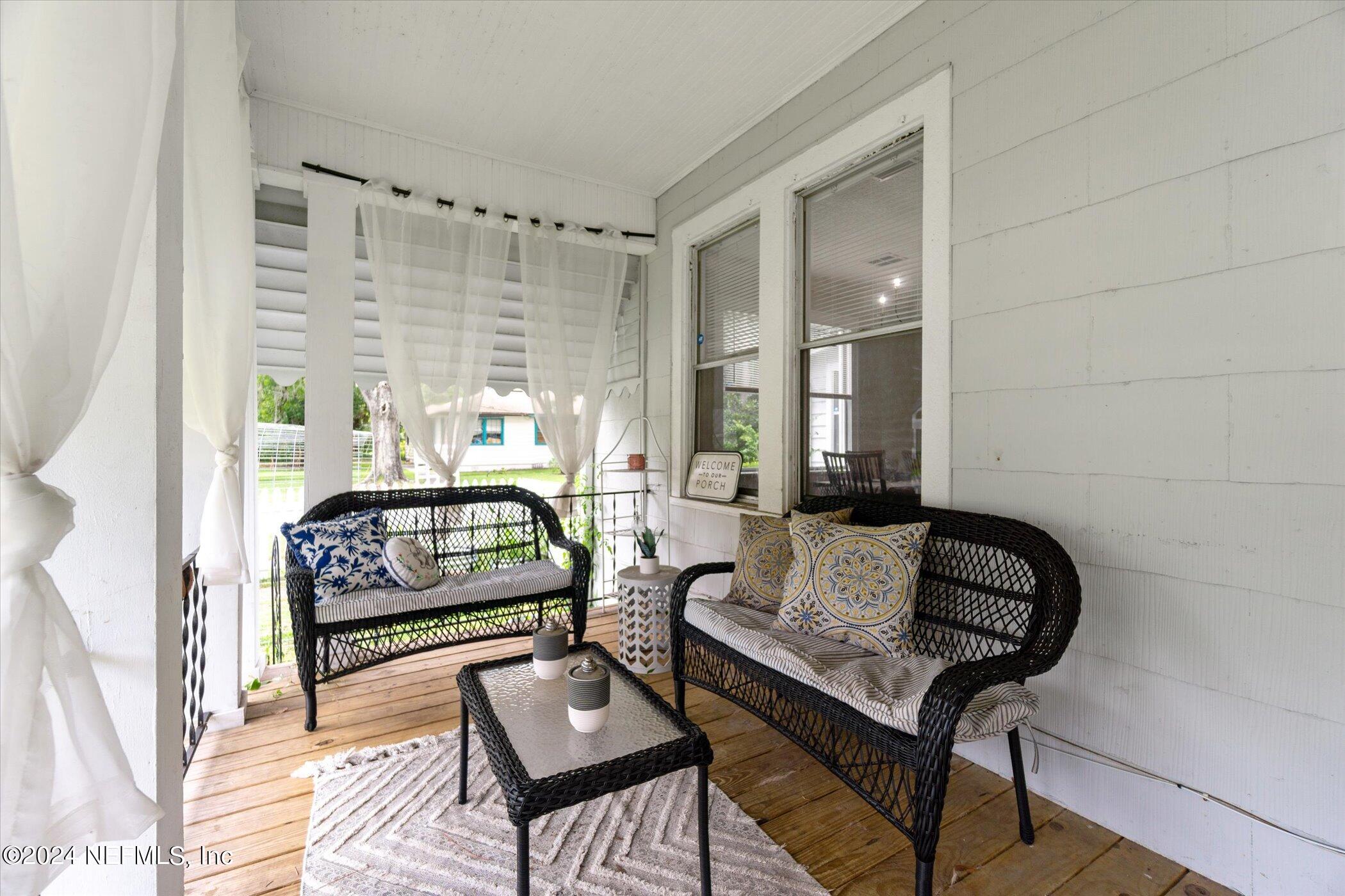 1262 Murray Drive Jacksonville, FL 32205 - Photo 8 of 42 a living room with furniture and a window