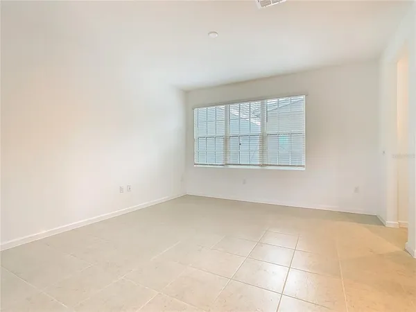 a view of a kitchen with a sink and cabinets