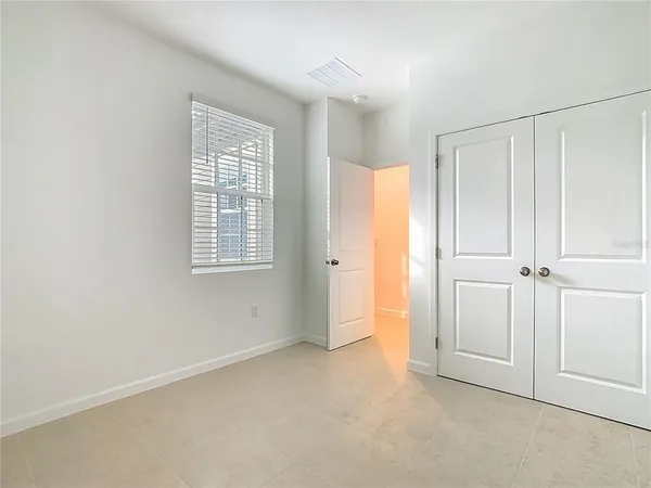 a bathroom with a white bath tub and a toilet