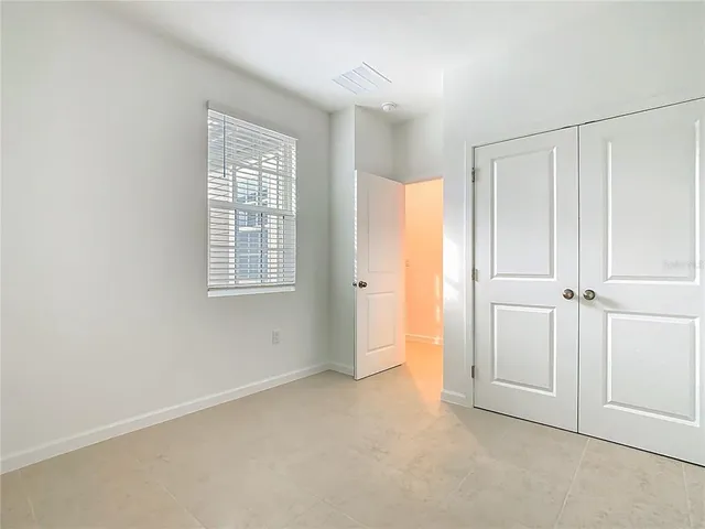 a bathroom with a white bath tub and a toilet