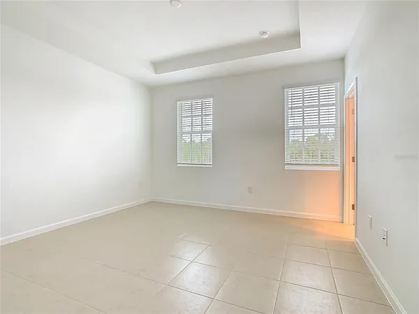 an empty room with a windows