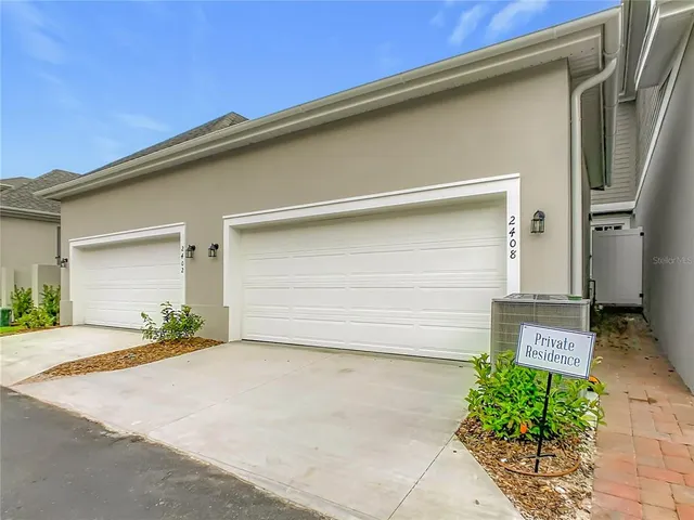 an aerial view of a house with a lake view
