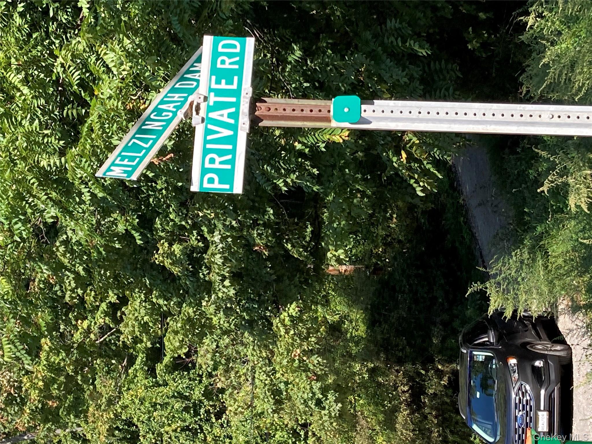 Melzingah Road Fishkill, NY 12524 - Photo 2 of 4 a street sign on a pole on a street