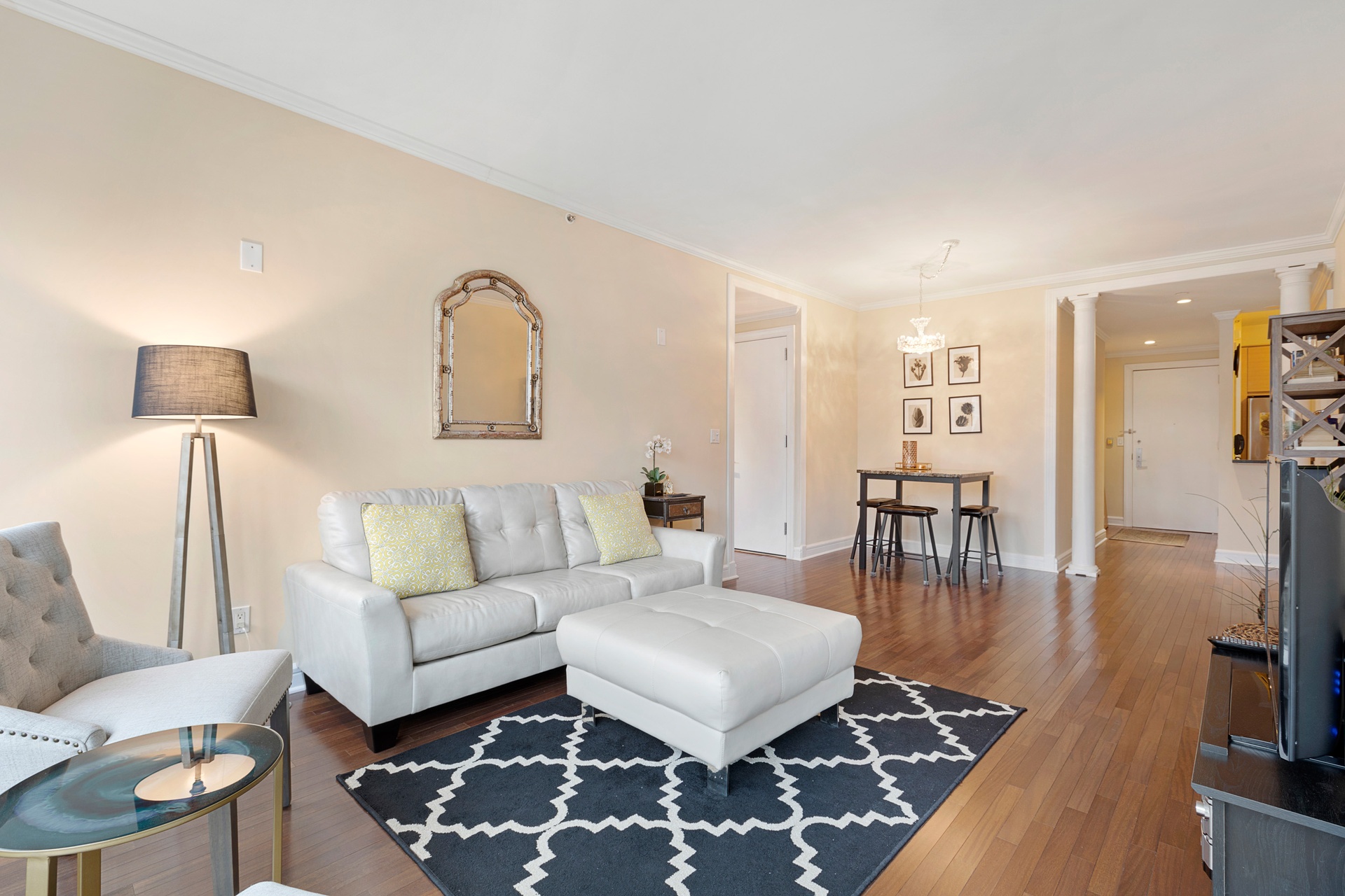120 Riverside Boulevard, Unit 8J Manhattan, NY 10069 - Photo 1 of 13 a living room with furniture and a wooden floor