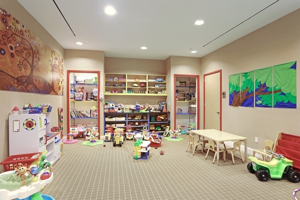 120 Riverside Boulevard, Unit 8J Manhattan, NY 10069 - Photo 11 of 13 a view of a play room with furniture and toys