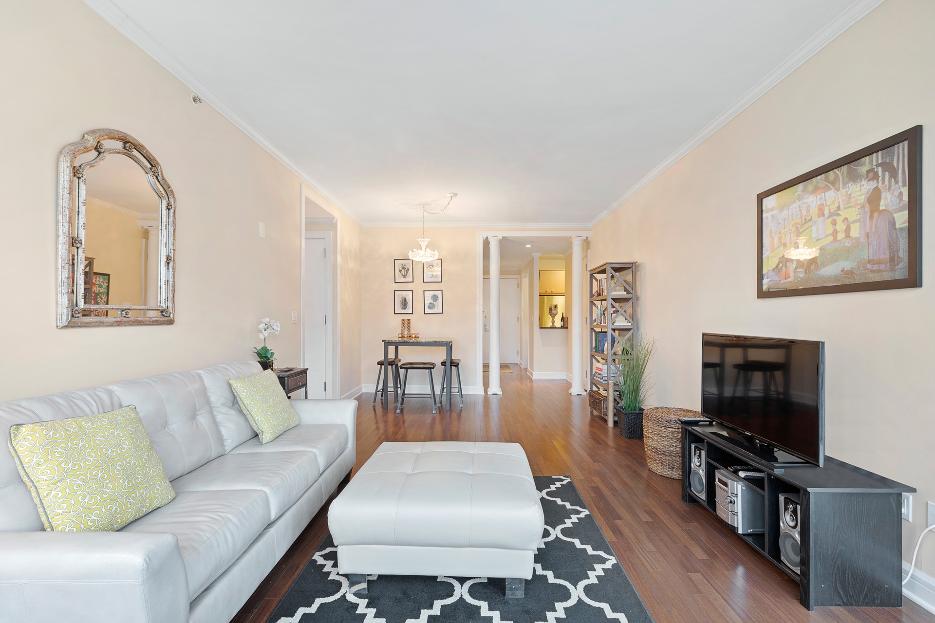 120 Riverside Boulevard, Unit 8J Manhattan, NY 10069 - Photo 2 of 13 a living room with furniture fireplace and flat screen tv